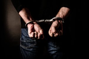image of a man in handcuffs