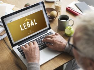 Man searching legal on a laptop